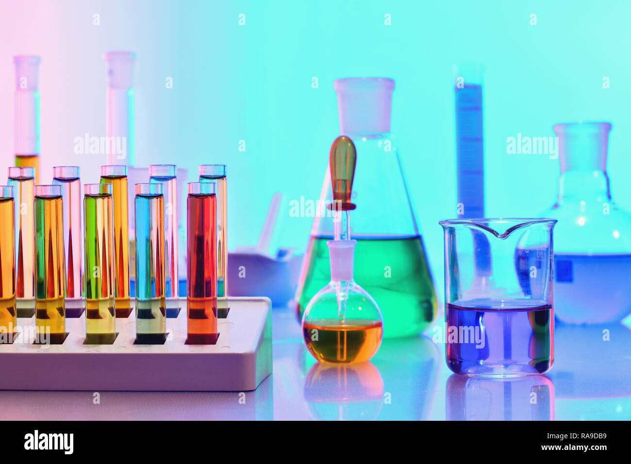 Laboratory glassware with colorful chemicals and reagents, chemistry