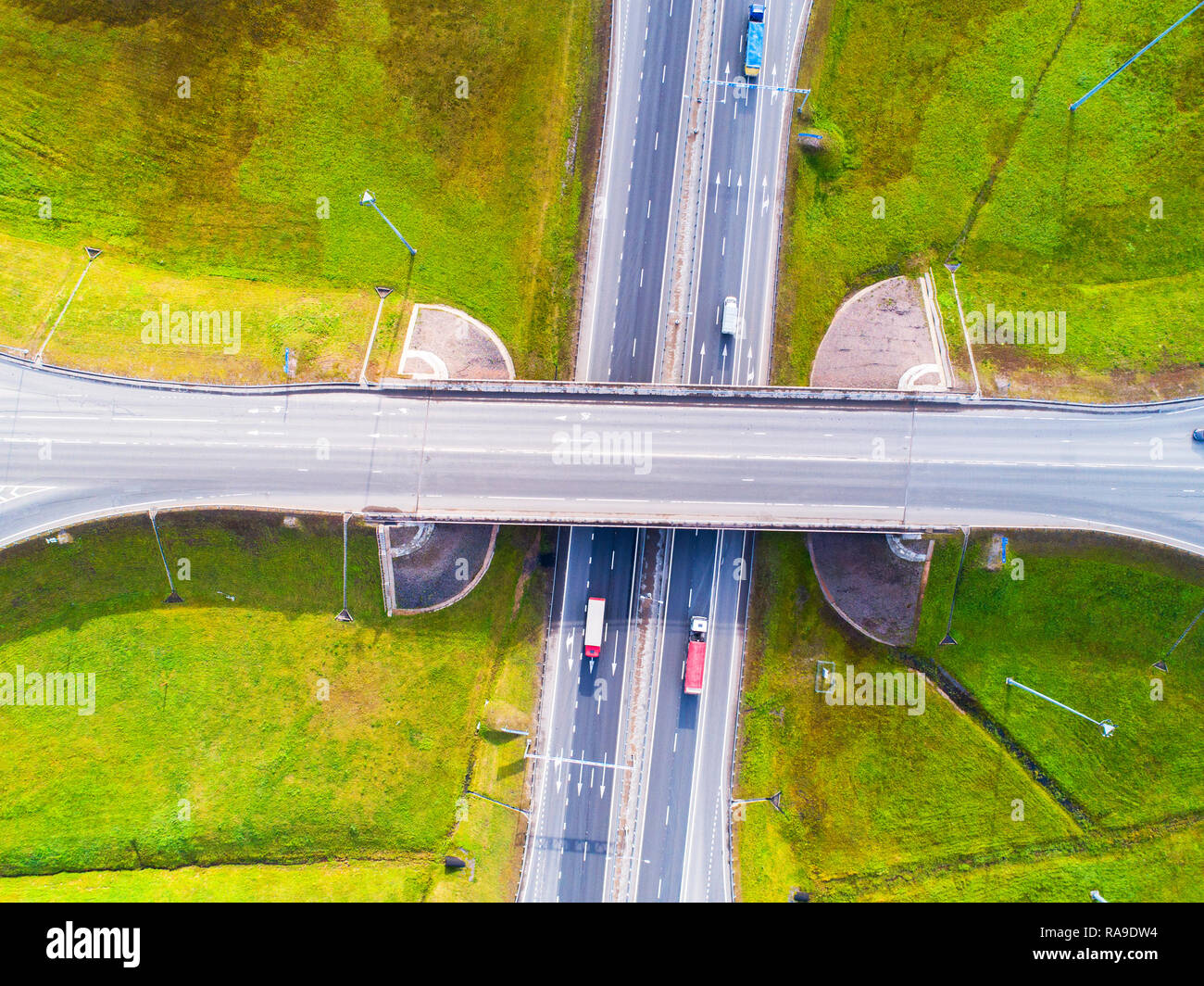 Aerial view of highway in city. Cars crossing interchange overpass ...