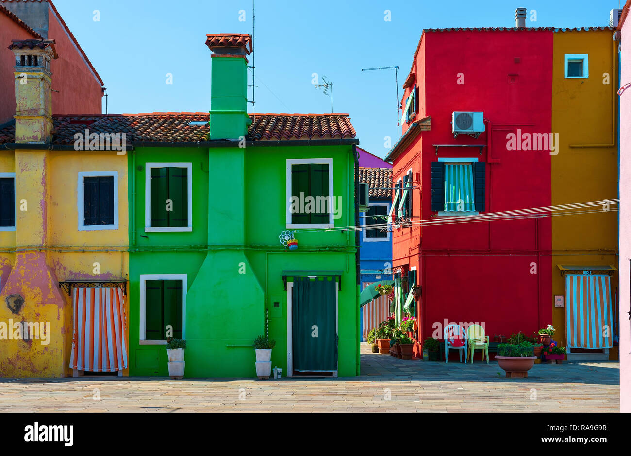 Facades of colorful houses on Burano island in summer Stock Photo - Alamy