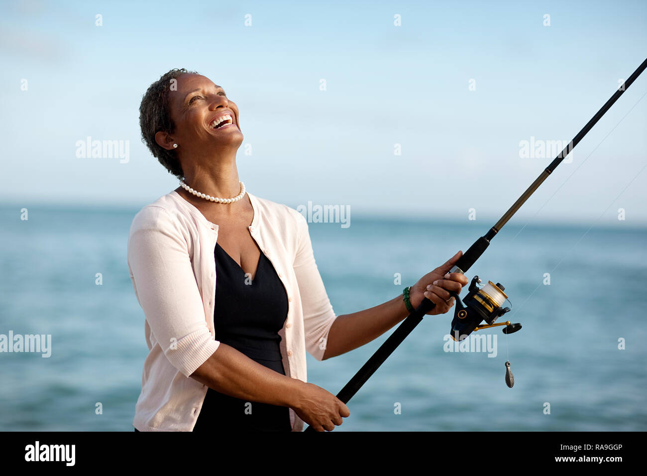 African american woman fishing hi-res stock photography and images - Alamy