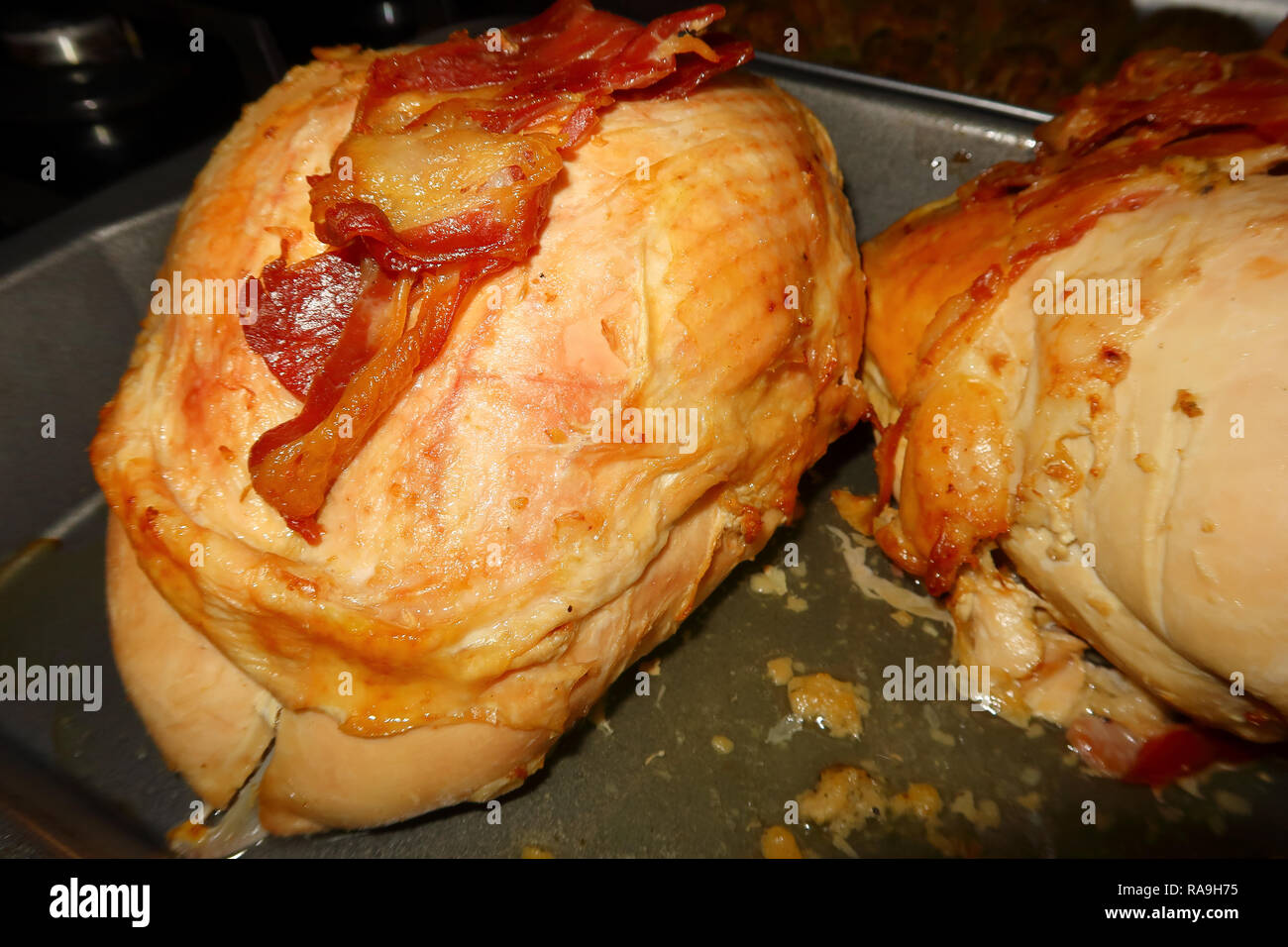 Roast Turkey Crown covered in Bacon Stock Photo