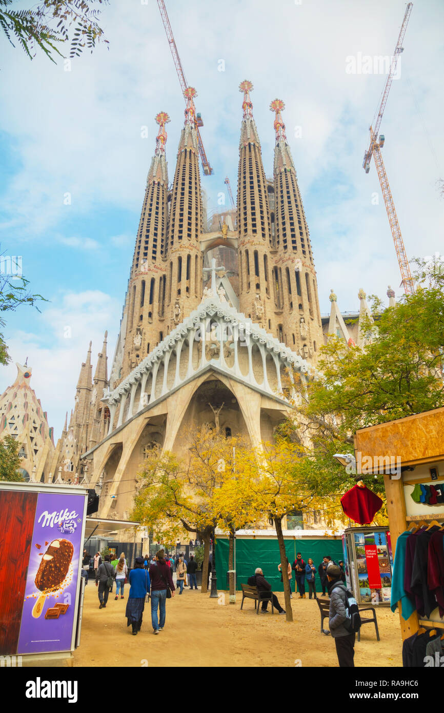 BARCELONA - DECEMBER 12: Overview with Sagrada Familia basilica with touristd on December 12, 2018 in Barcelona, Spain. Stock Photo