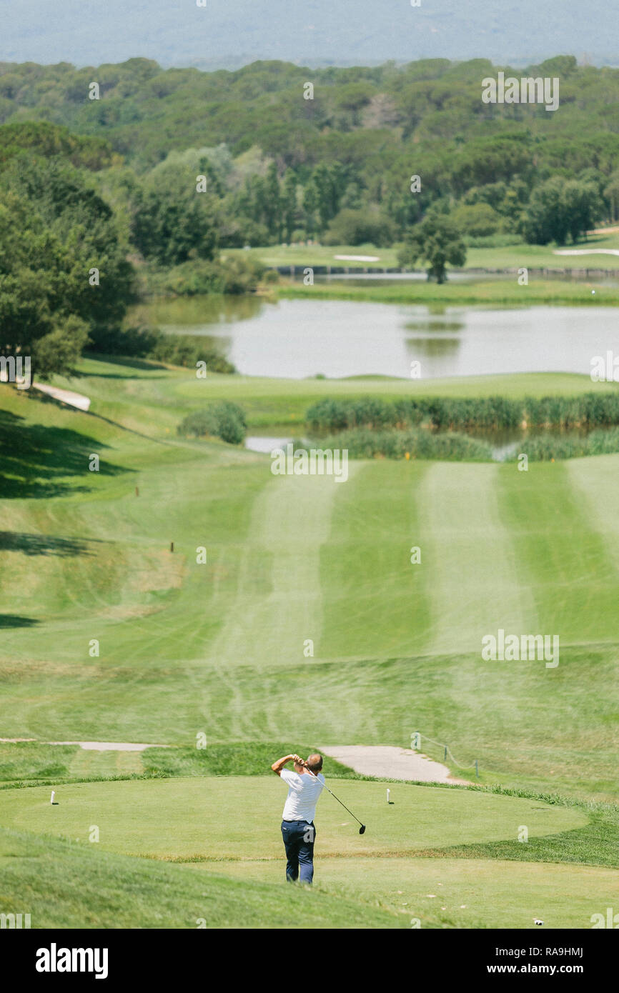 Golfers playing on a golf green in Hotel Camiral, Girona, Catalonia. Spain  Stock Photo - Alamy