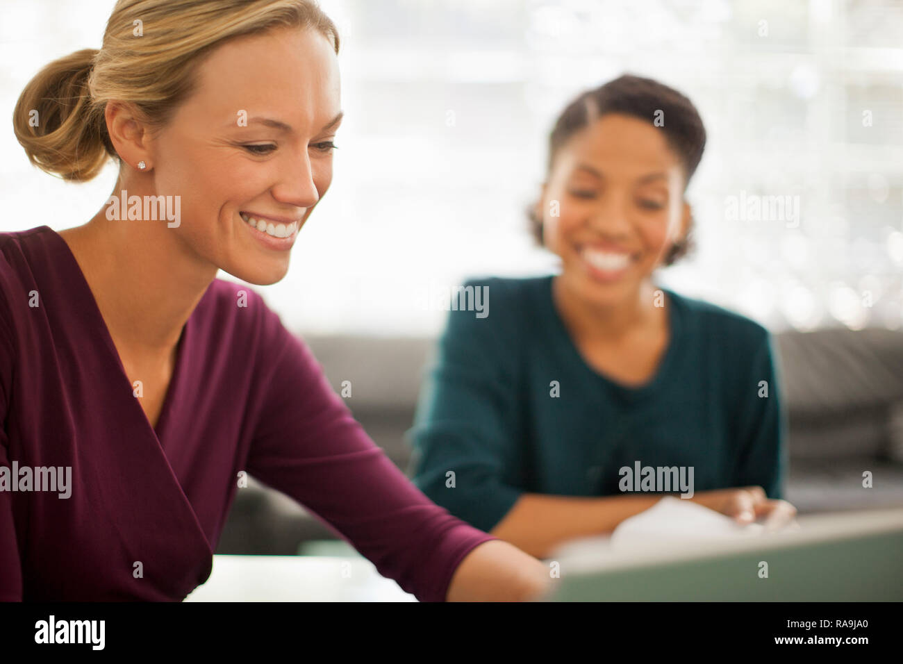 Happy colleagues working together on a project. Stock Photo