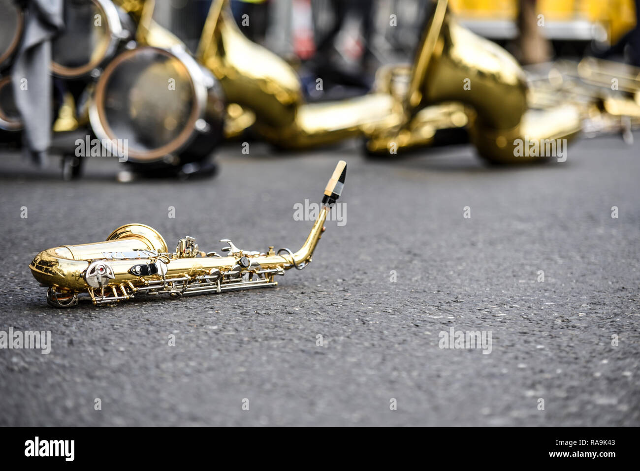 Saxophone on the floor isolated from other brass instruments at London's New Year's Day Parade, UK. Preparation for event Stock Photo