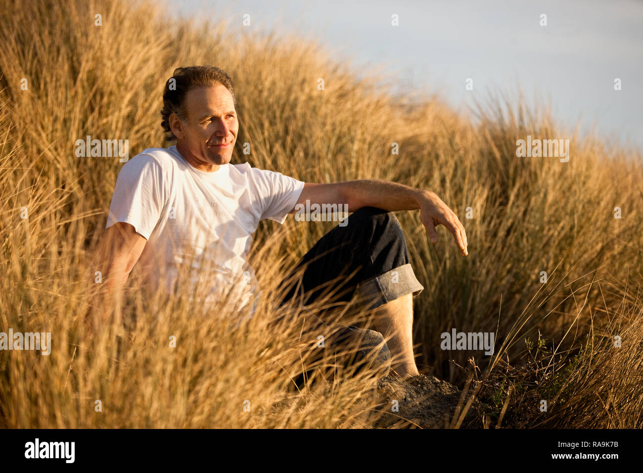 Mature man looking into the distance. Stock Photo