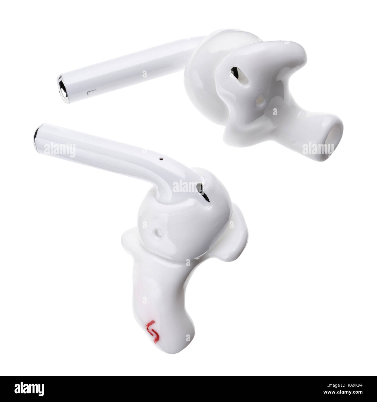 Apple Airpod wireless earbuds with Snugs fitted moldings. Stock Photo