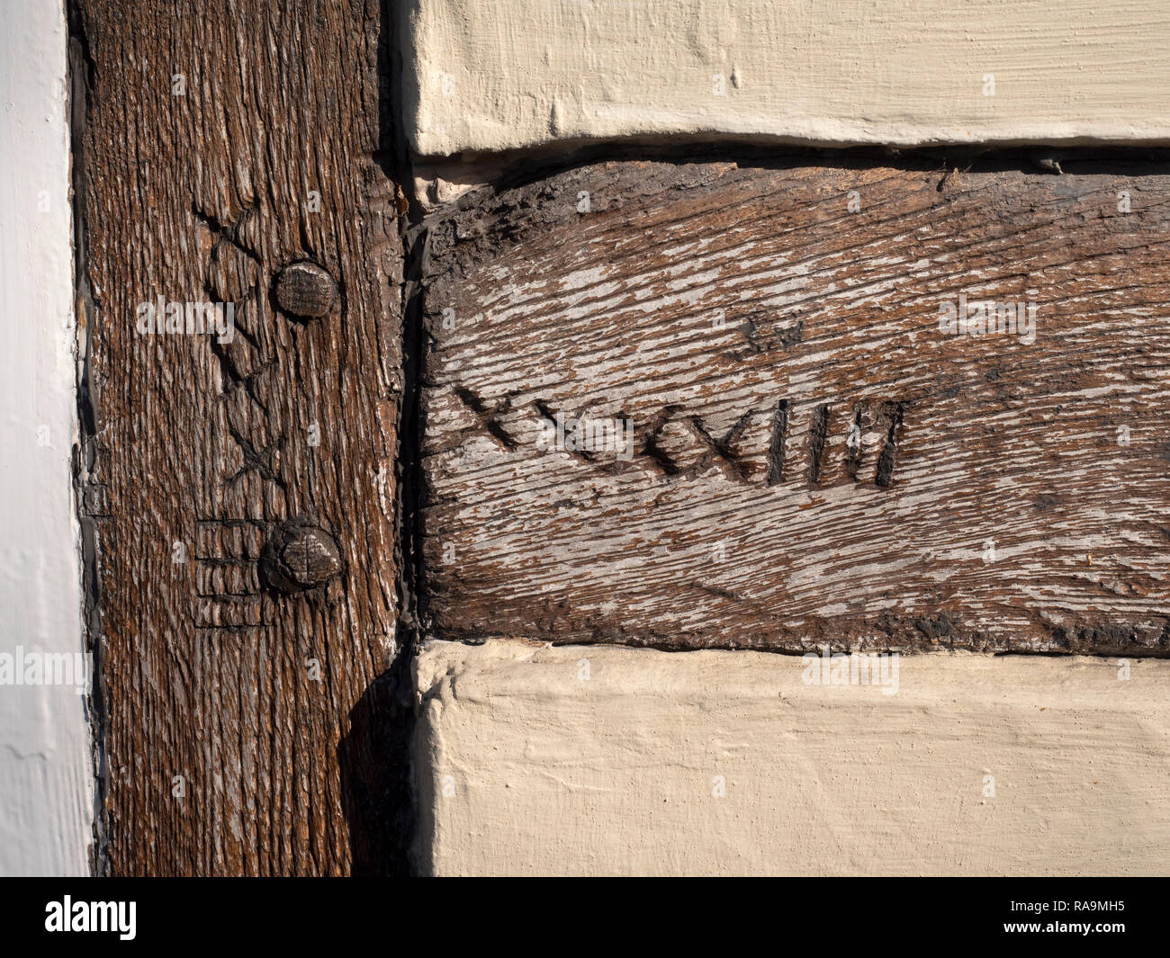 Close up of 17th century carpenters markings on the beams of oak framed house at 84 Main Road, Frodsham, Cheshire, England, UK. Stock Photo