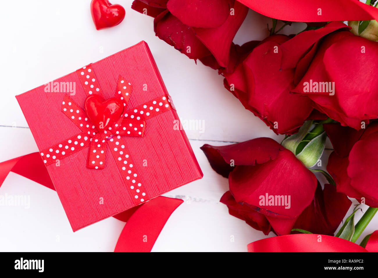 Red roses and Valentines day present box on white background Stock ...