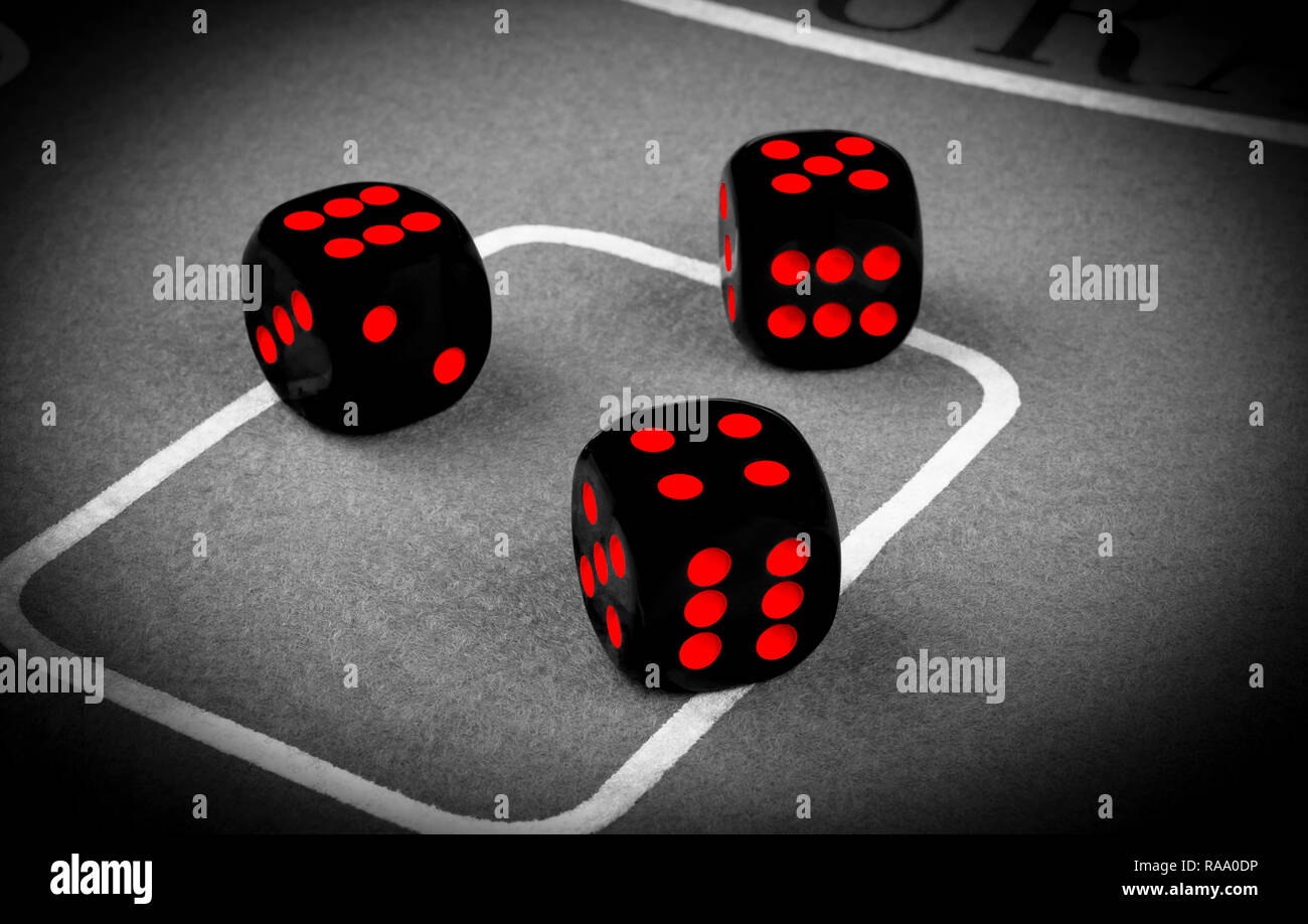 risk concept playing dice on a green gaming table. Playing a game