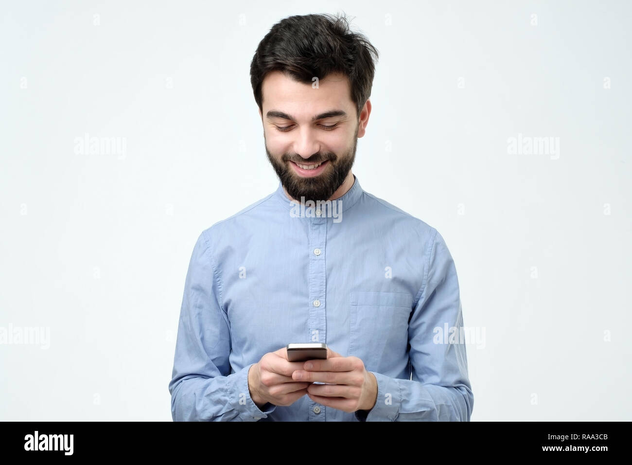 Young business man using a mobile phone Stock Photo