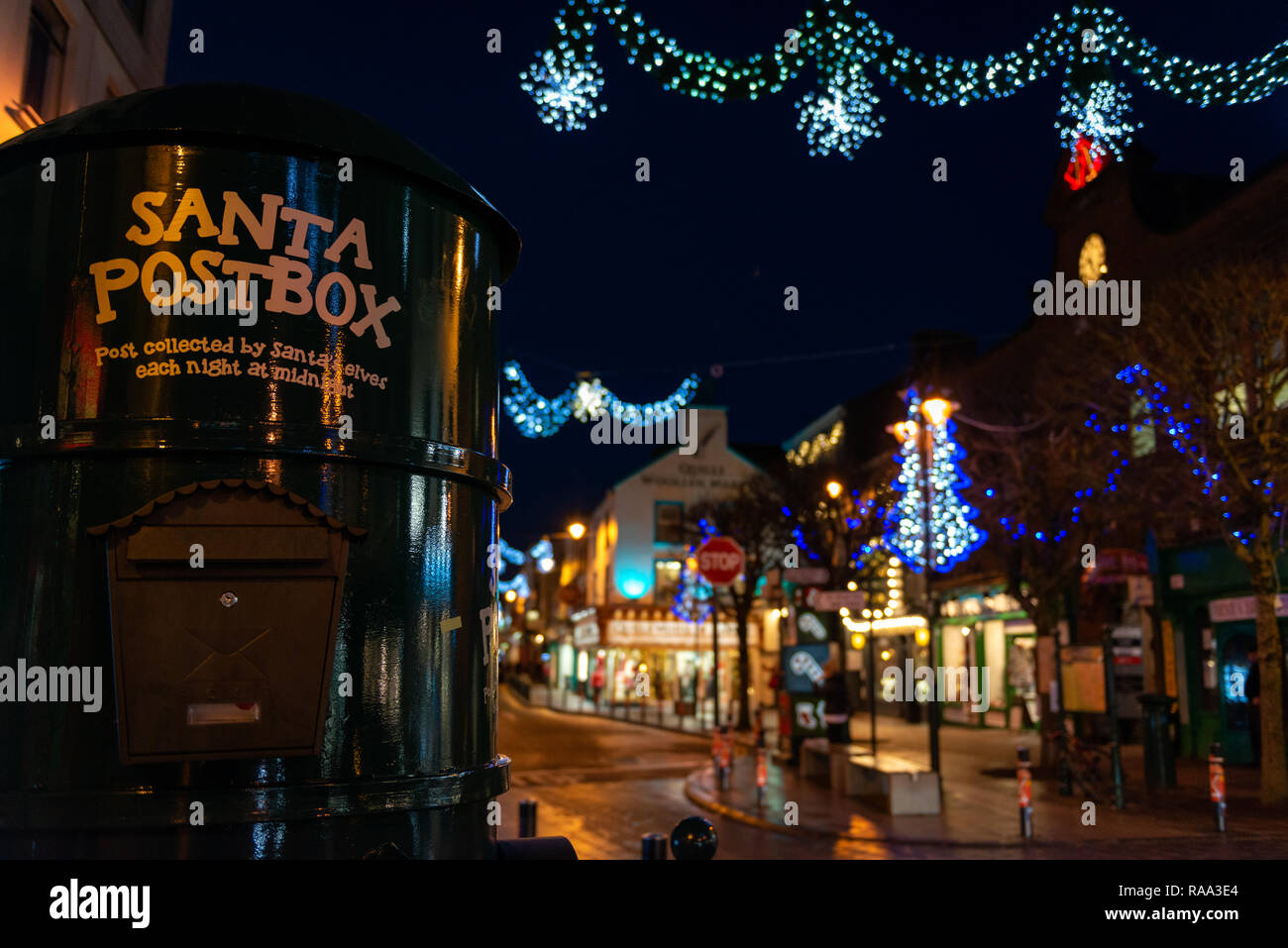 Christmas Ireland and Santa post box or mail box or letterbox and Christmas street lights during the festive celebrations in Killarney,  Ireland Stock Photo
