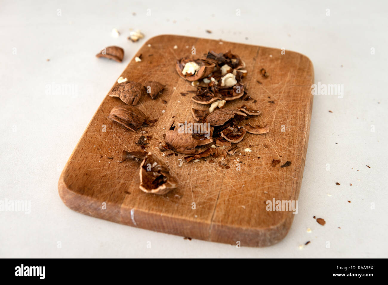 Cracked walnuts on wooden board Stock Photo