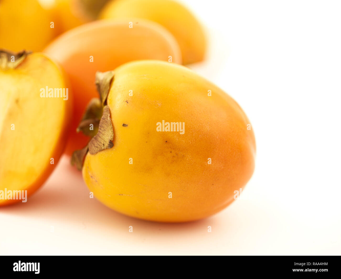 Sharon fruit against a white background fruit still-life Stock Photo