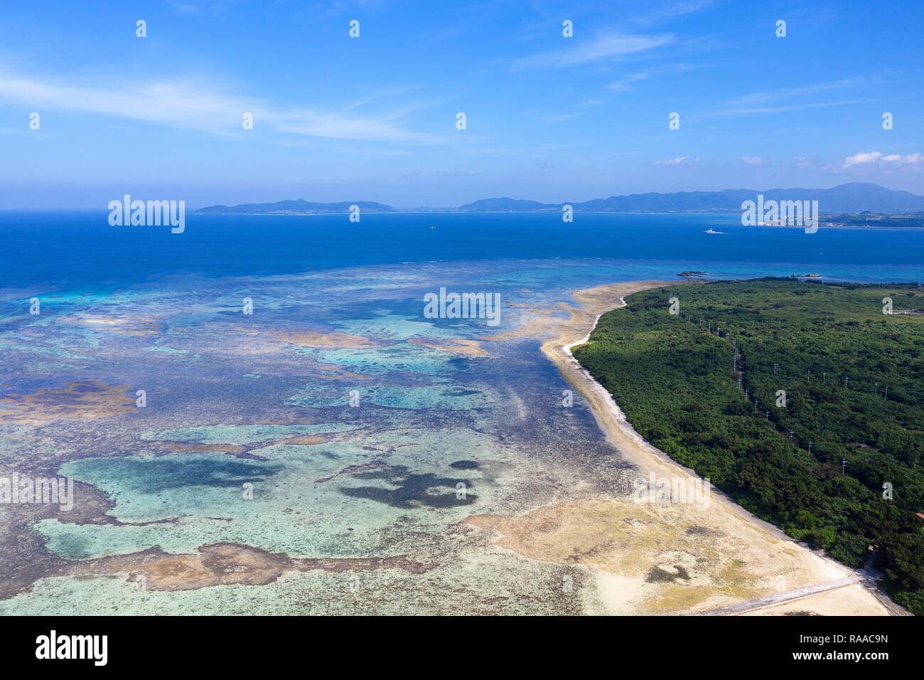 Aerial view of spectacular white coral sand beach and clear turquoise waters on Taketomi Island, Yaeyama, Okinawa, Japan, taken by drone Stock Photo
