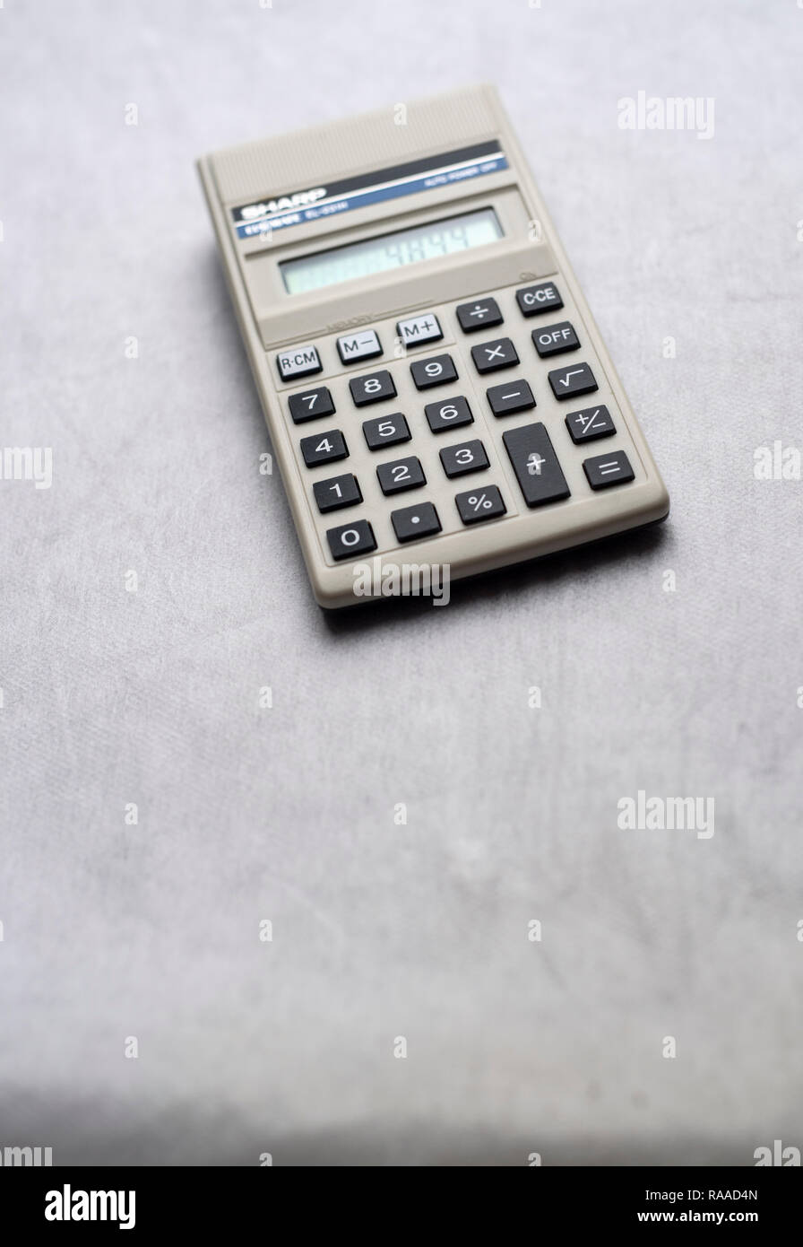 Still life of an old Sharp calculator isolated on a neutral background Stock Photo