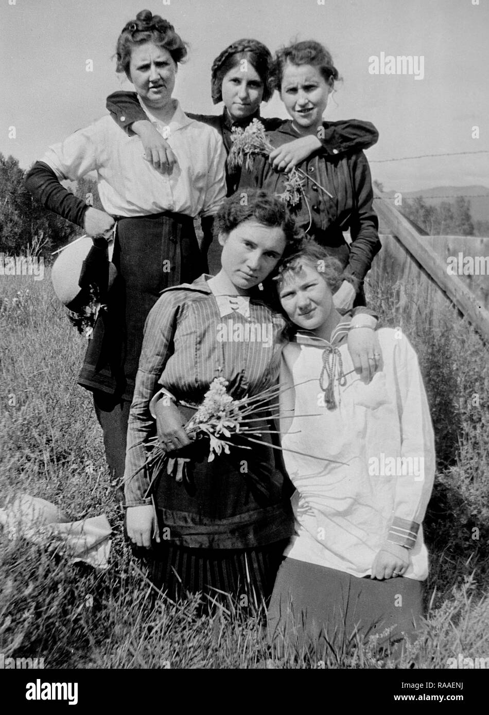 Five  young women pose together in a Colorado field, ca. 1928. Stock Photo