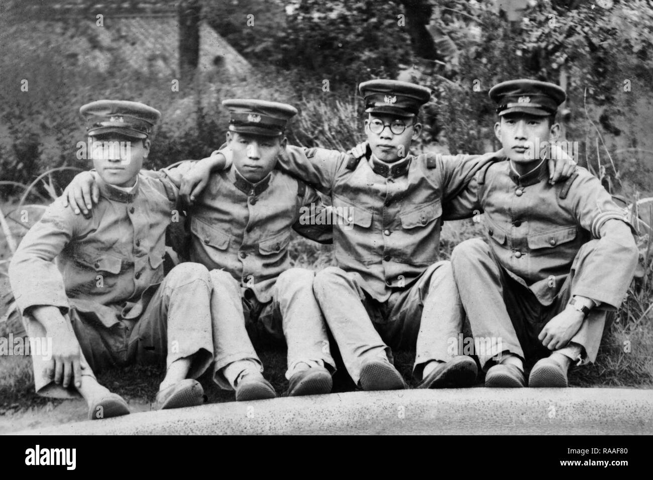 Four Japanese soldiers pose together, ca. 1933. Stock Photo