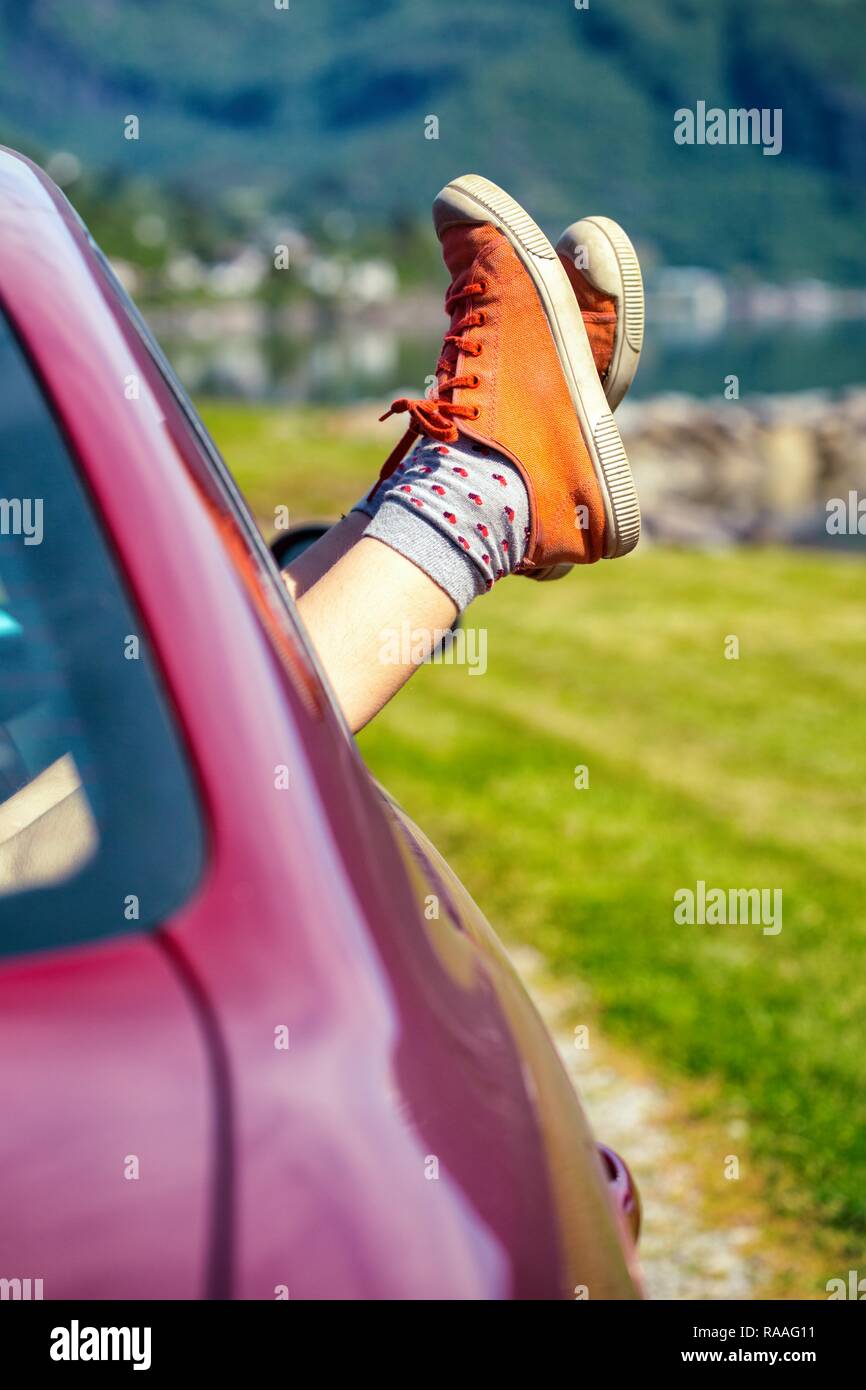 Legs sticking out of car hires stock photography and images Alamy