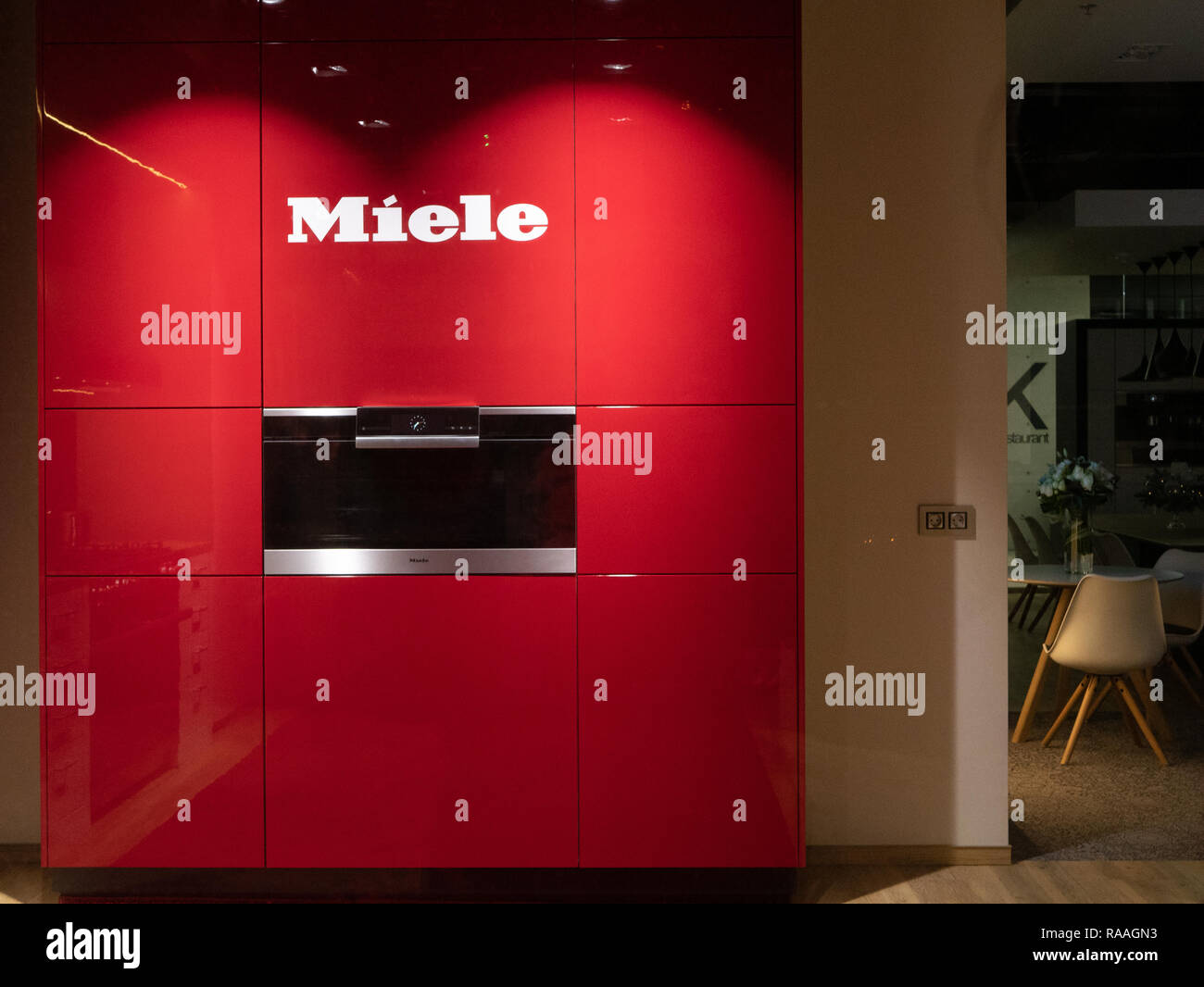 KYIV, UKRAINE - DECEMBER 30, 2018: Bright red kitchen inside MIELE retail store. Miele is German Based Manufacturer of Premium Class Household Applian Stock Photo