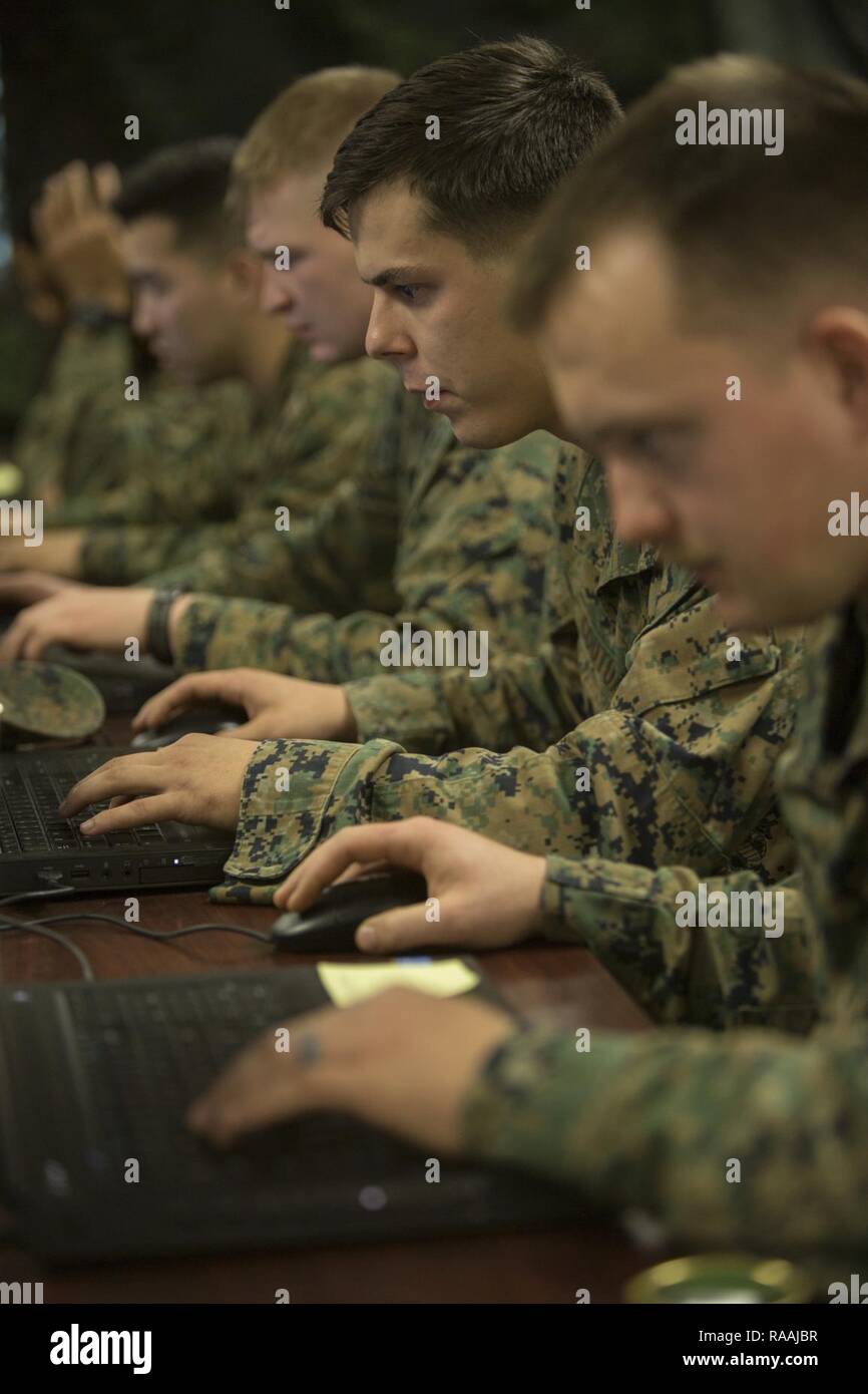 U.S. Marines with 2nd Battalion, 6th Marine Regiment, 2nd Marine Division (2d MARDIV), compete in the Spartan Tactical Games utilizing Virtual Battlespace 3 (VBS 3) on Camp Lejeune, N.C., Jan. 11, 2017. VBS 3 and the Spartan Tactical Games allow the Marines to test their tactical and cognitive thinking while competing against each other on a squad level. Stock Photo