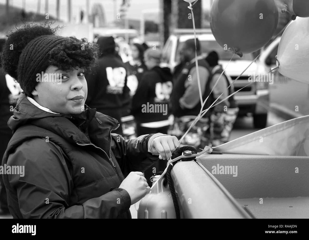 Ms. Jennifer Stewart, architect, Tulsa District, U.S. Army Corps of Engineers, ties balloons onto a boat used by the district during the 38th annual Martin Luther King Jr. Commemorative Parade in Tulsa, Okla., January 16, 2017.   Personnel from the Tulsa District have been participating in the city of Tulsa's MLK Day parade for more than 20 years. Stock Photo
