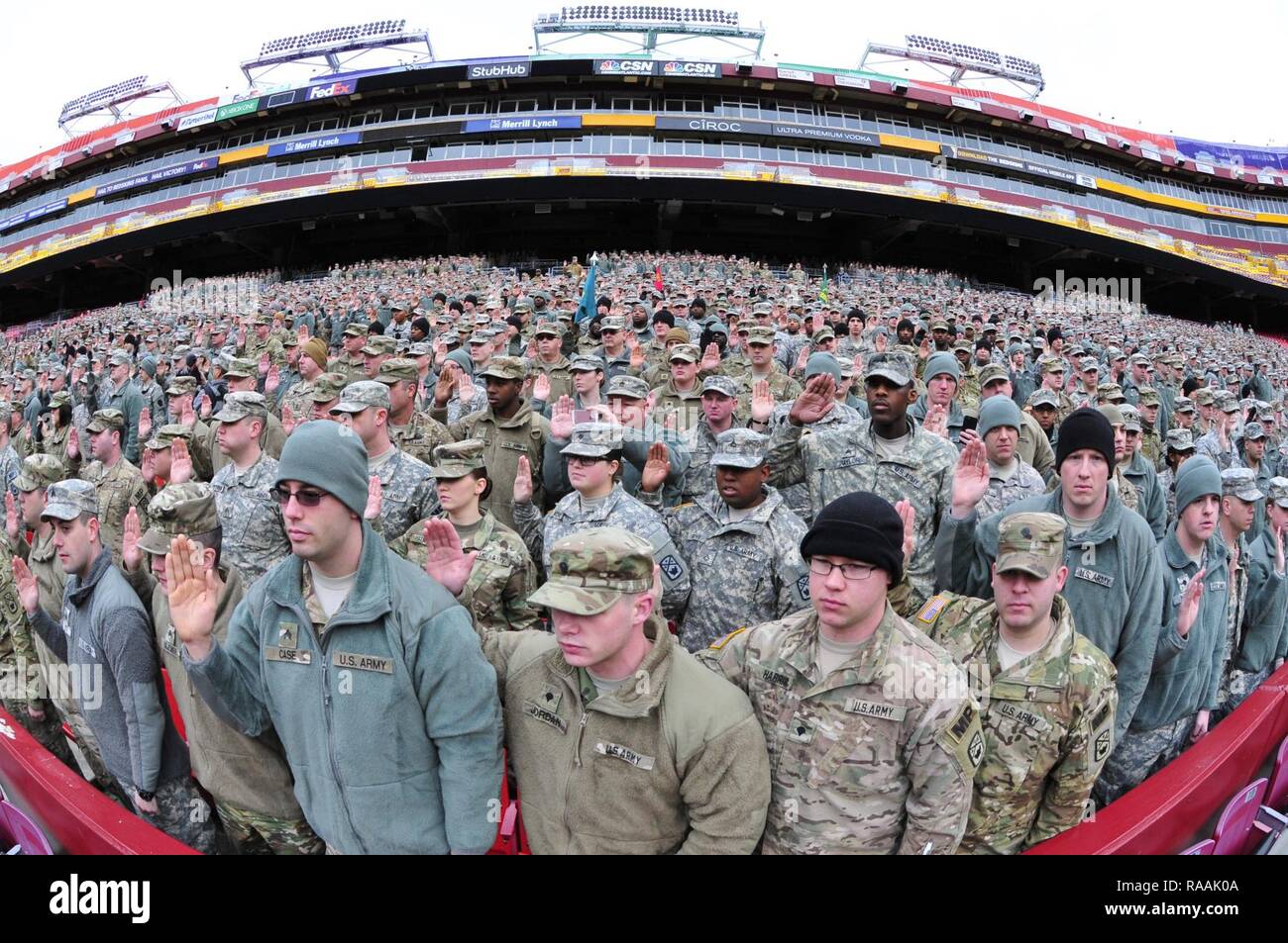 National Guard soldiers and airmen swear in as District of Columbia special police at FedEx Field in Landover, Md., Jan. 19, 2017. The troops are here in preparation for the 58th Presidential Inauguration. During the event, National Guard troops from almost every state and territory will provide several critical functions including crowd management, traffic control, emergency services, logistics, and ceremonial marching elements. Stock Photo