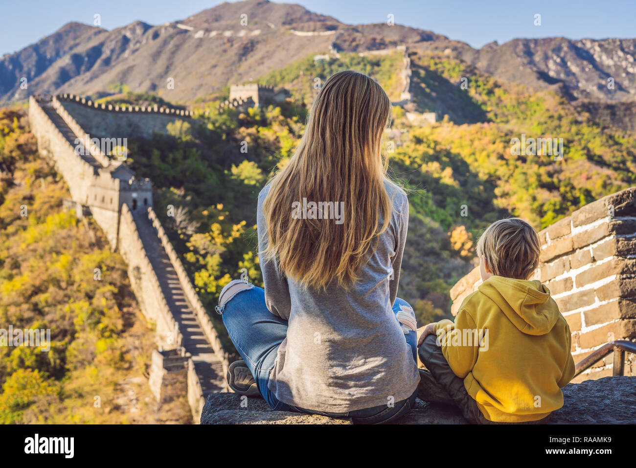 Happy cheerful joyful tourists mom and son at Great Wall of China meditate  on vacation trip in Asia. Chinese destination. Travel with children in  China concept Stock Photo - Alamy