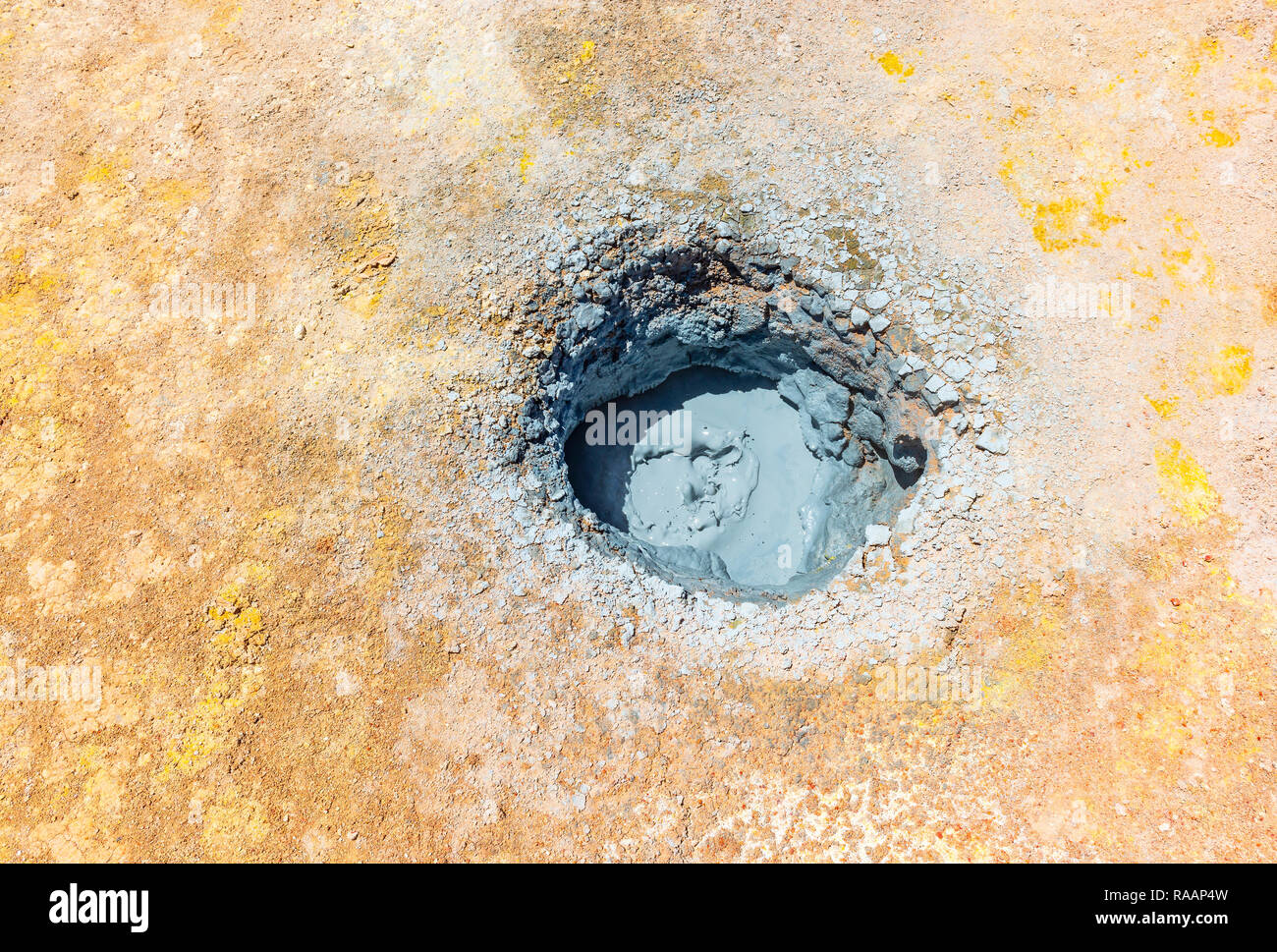 A mud pit in the volcanic active hot spot of Sol de Mañana in the altiplano of Bolivia located between the Uyuni salt flat and the Atacama desert. Stock Photo