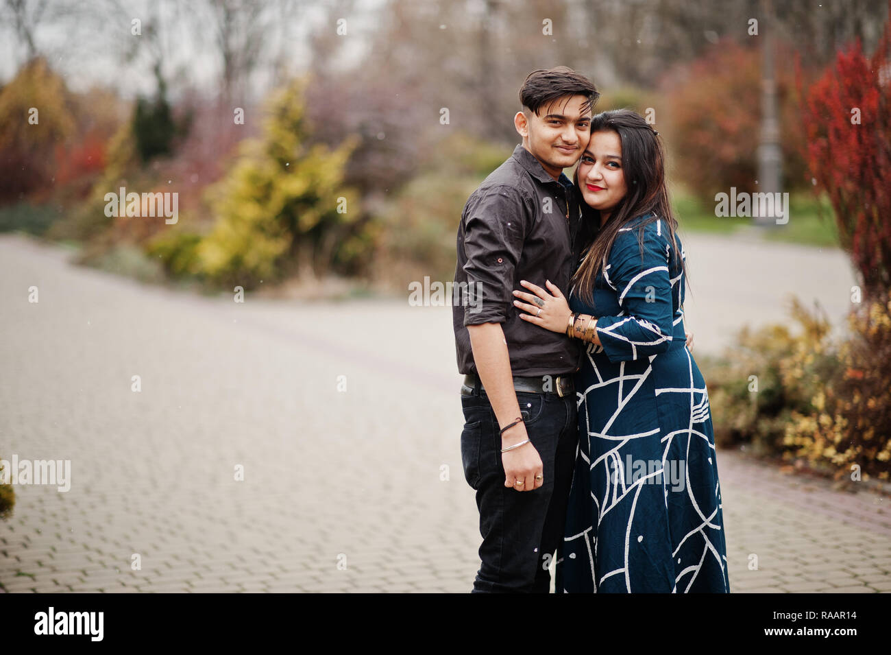 Love story of indian couple posed outdoor Stock Photo - Alamy