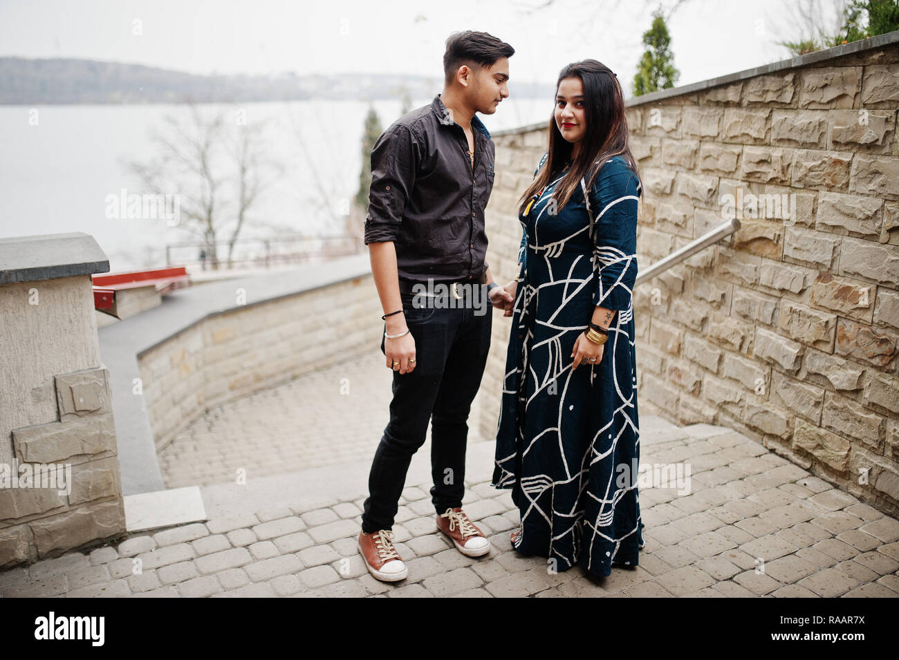 Love story of indian couple posed outdoor Stock Photo - Alamy