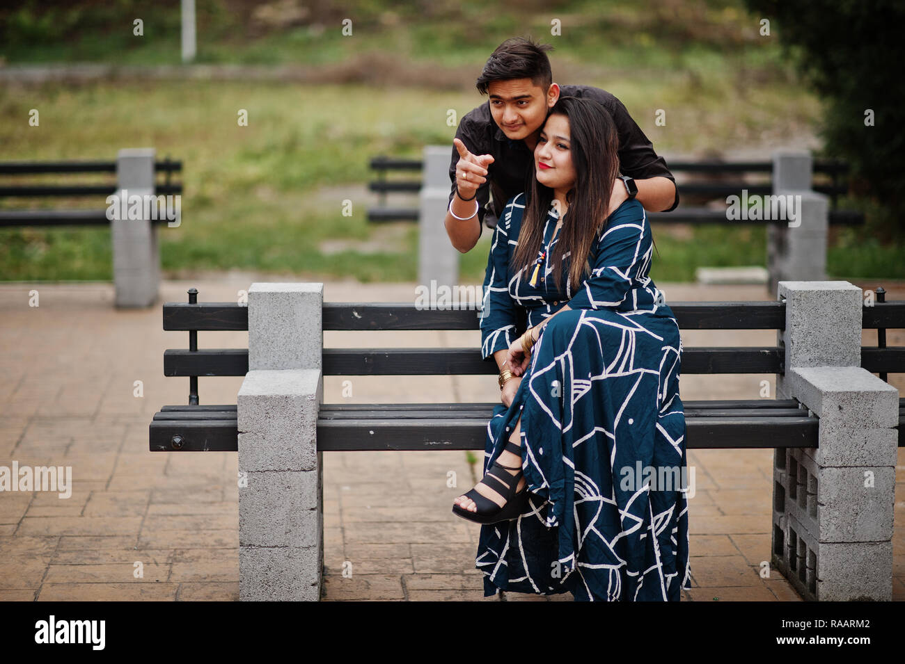 man and woman on a bench in the park 11357501 Stock Photo at Vecteezy