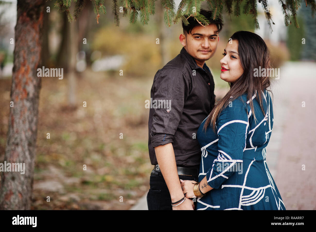 Love story of indian couple posed outdoor Stock Photo - Alamy