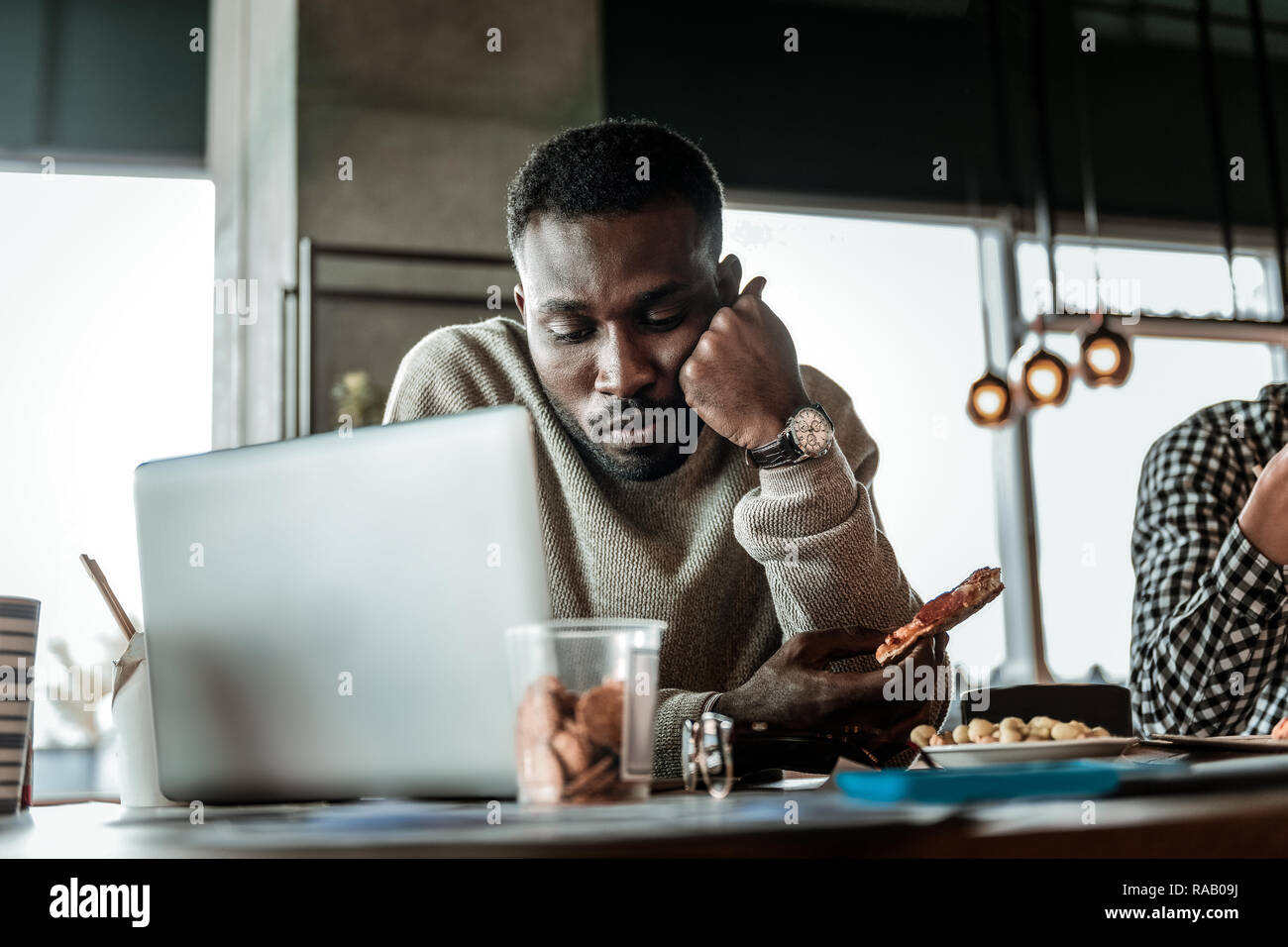 Serious international man being deep in thoughts Stock Photo Alamy