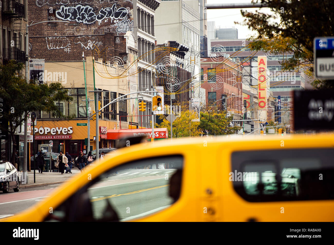 Daily life in Harlem with the famous Apollo theatre in the background. Stock Photo