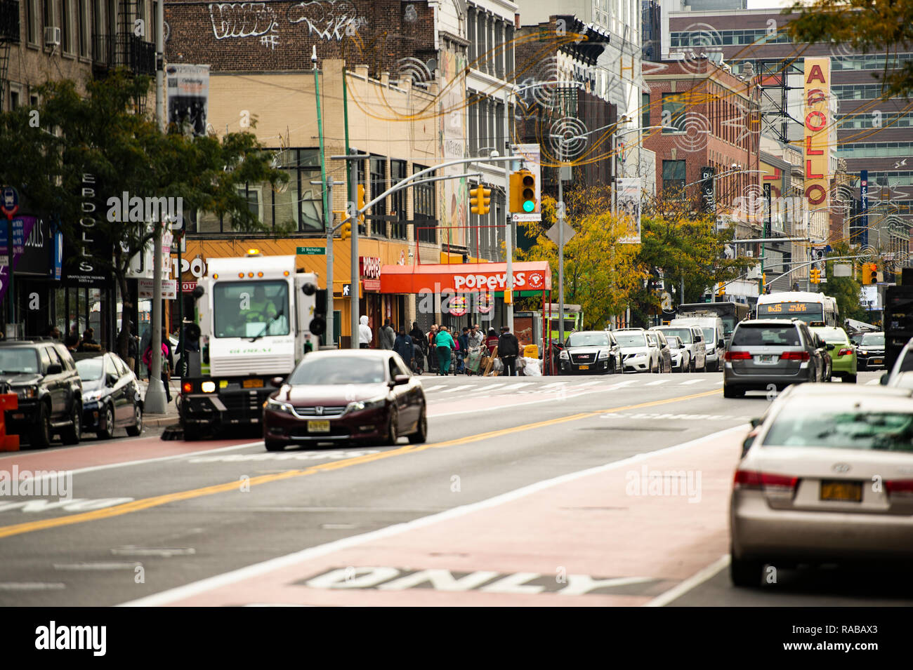 Daily life in Harlem with the famous Apollo theatre in the background. Stock Photo