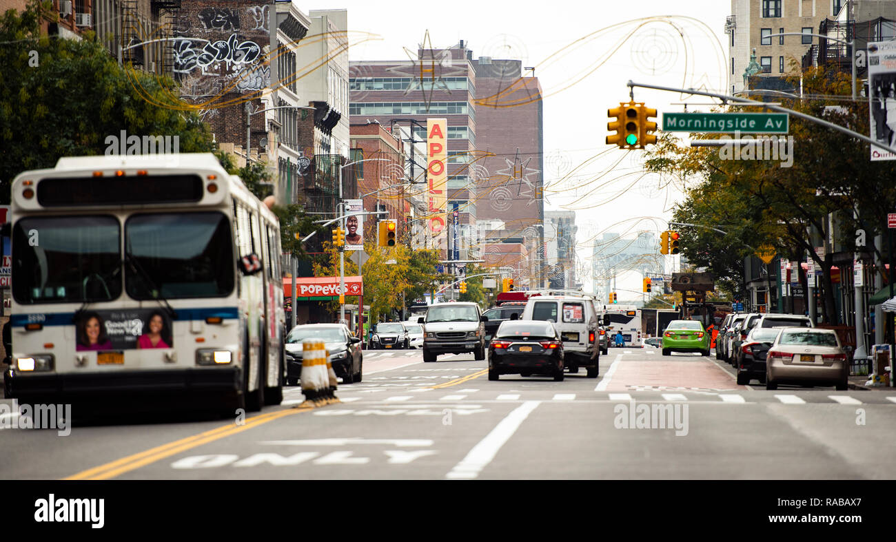 Daily life in Harlem with the famous Apollo theatre in the background. Stock Photo