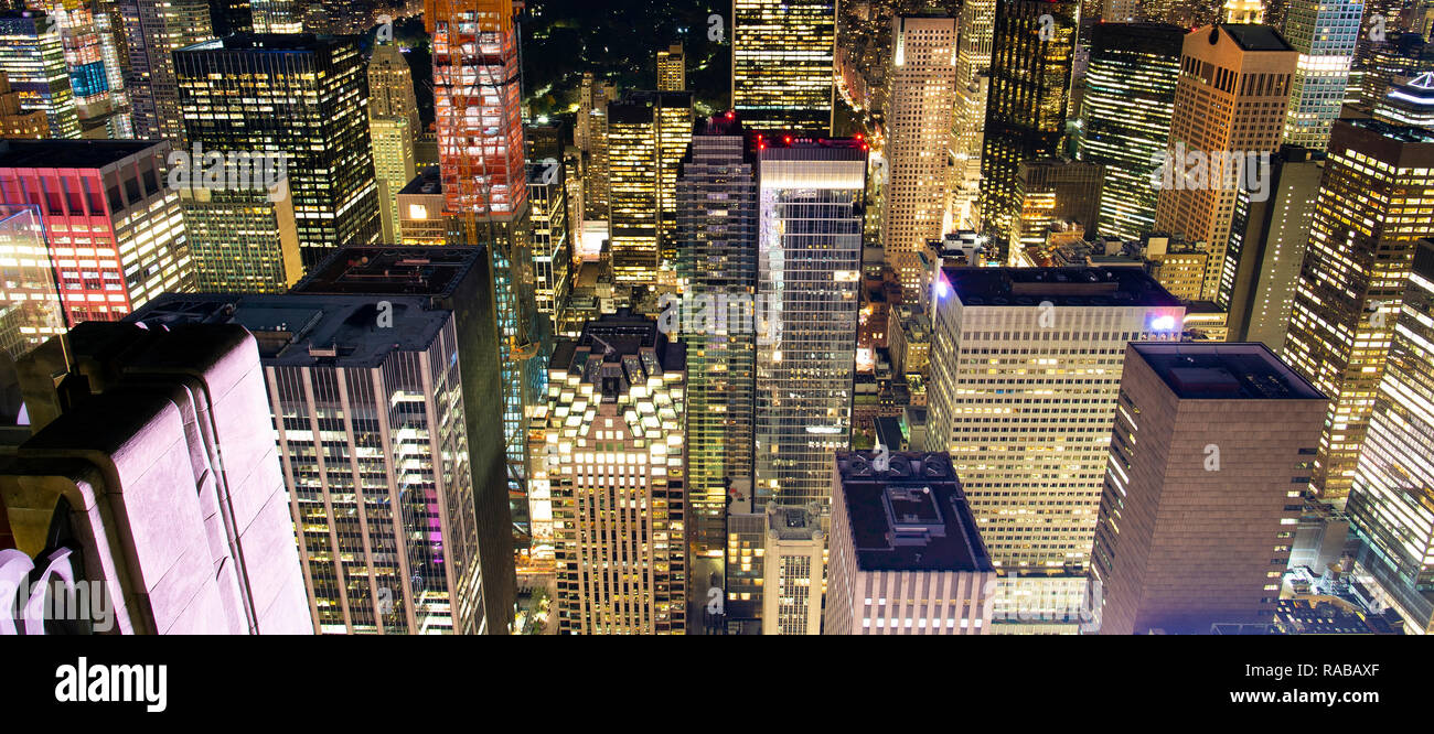 Aerial view of the spectacular Manhattan skyline illuminated at night. New York City, USA. Stock Photo