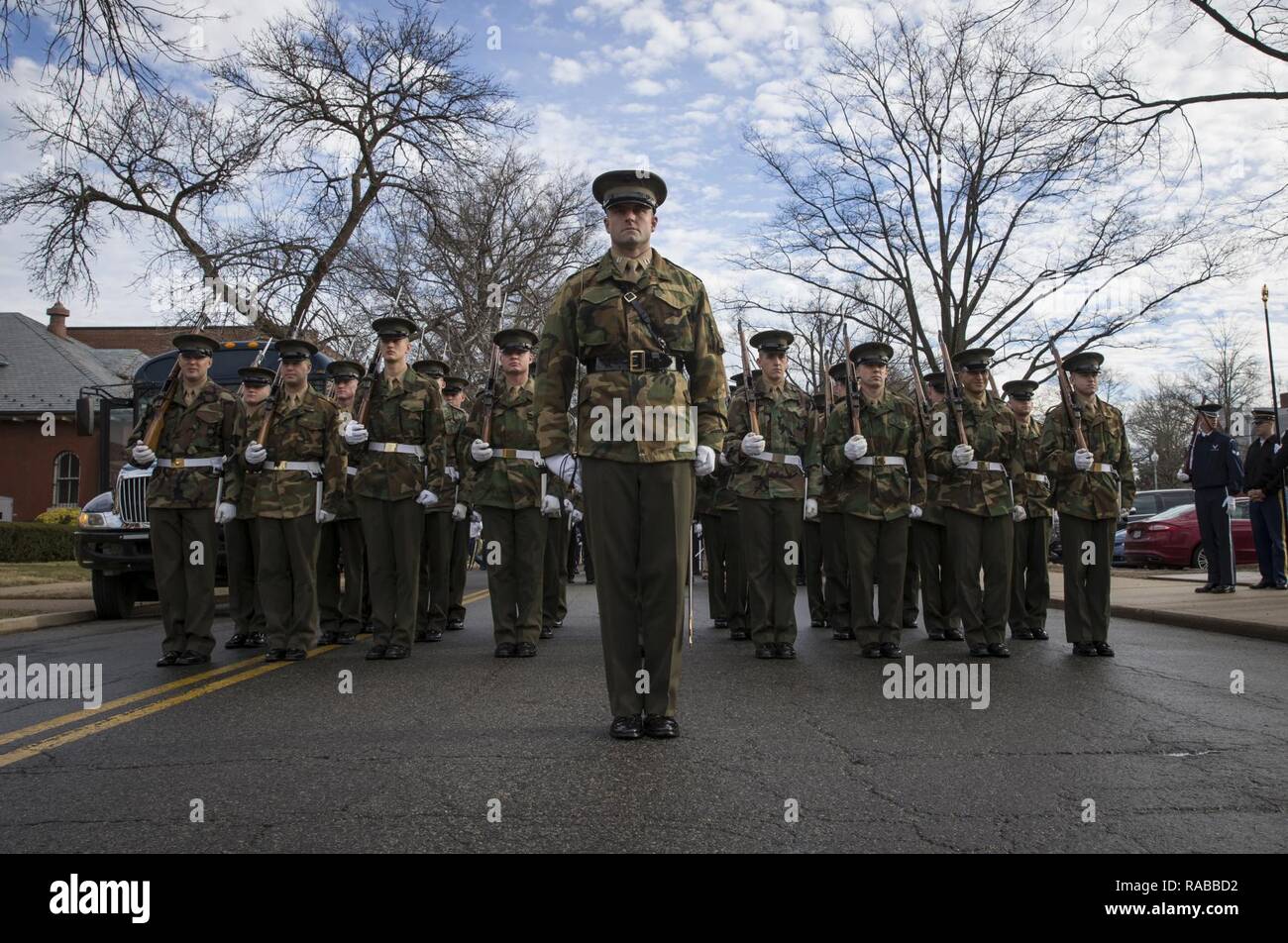 Members of the U.S. Marine Corps Honor Guard stand at attention before rehearsing for the 58th Presidential Escort on Joint Base Myer-Henderson Hall, Va., Jan. 12, 2017. More than 5,000 service members are providing military ceremonial support for the 58th Presidential Inauguration, a time honored tradition that dates back to 1789 when George Washington was escorted to Federal Hall in New York City to be sworn in as the first commander in chief. Stock Photo