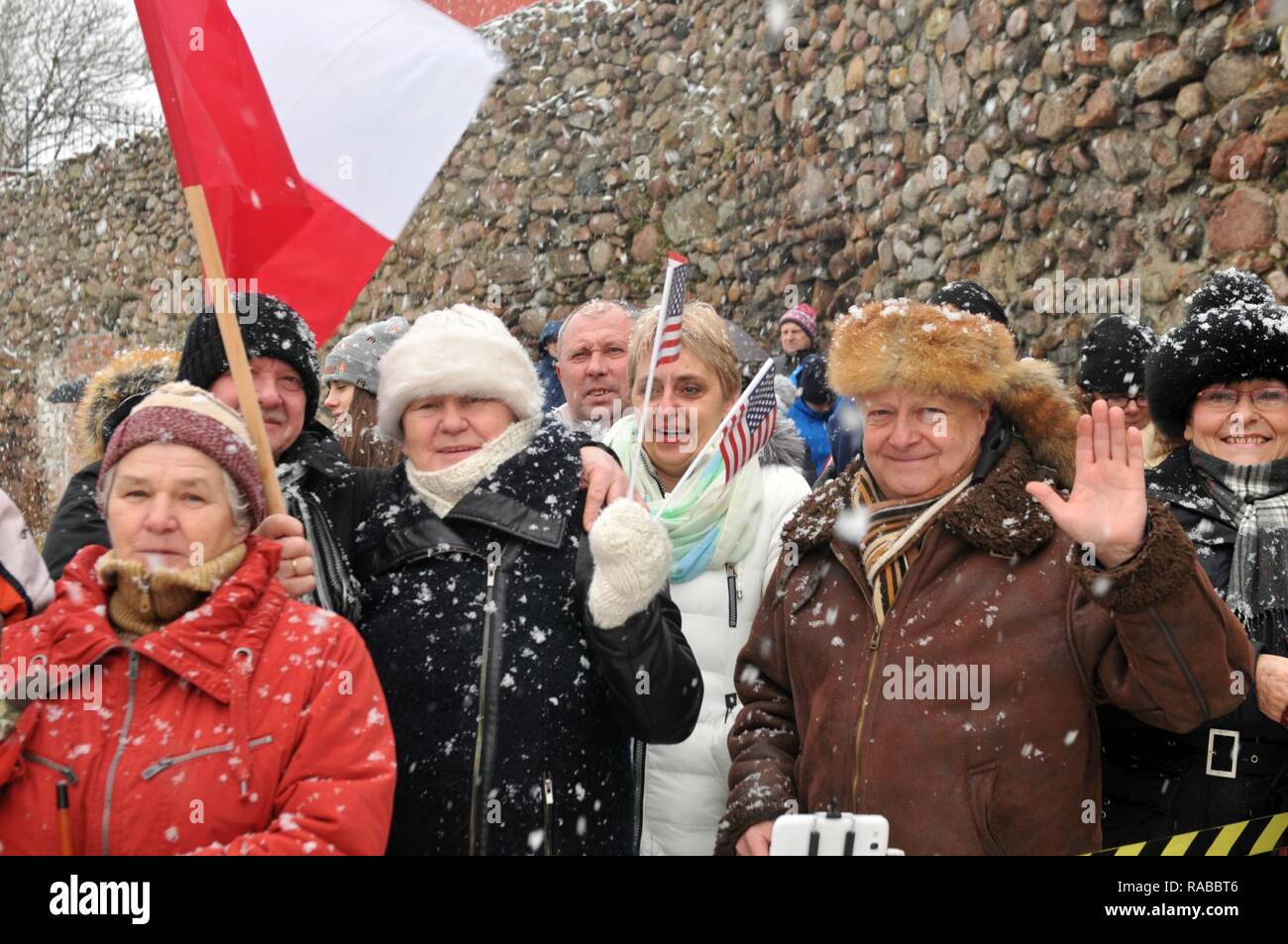 ZAGAN, Poland— Citizens of Poland show their support during a ceremony