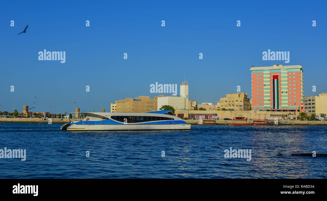 Dubai, UAE - Dec 9, 2018. A speedboat running on Dubai Creek. The creek is a man-made waterway made for the convenience of trade ships. Stock Photo