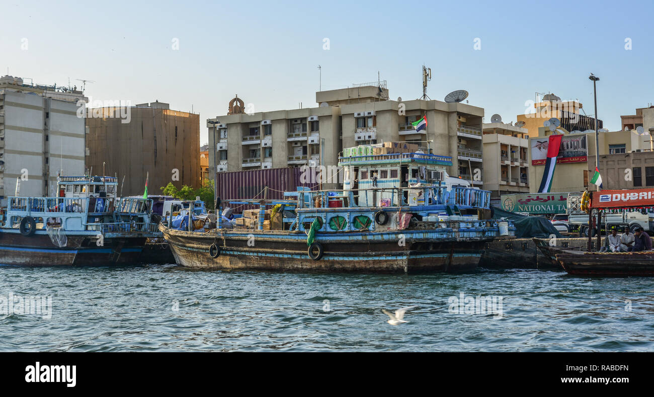 Dubai, UAE - Dec 9, 2018. Wooden boat (water bus) on Dubai Creek. The creek is a man-made waterway made for the convenience of trade ships. Stock Photo