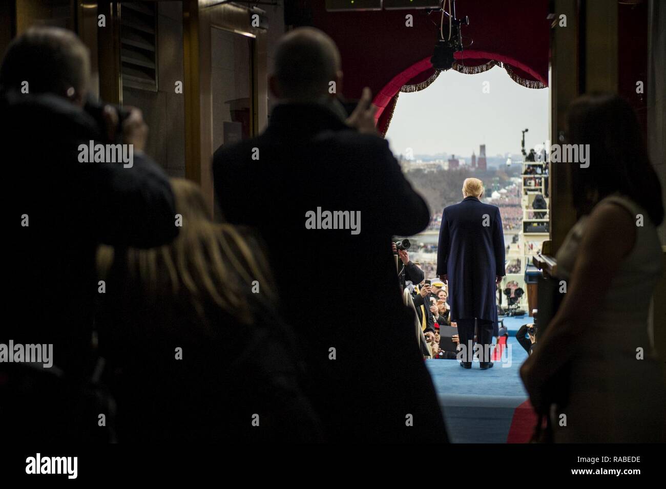 President-elect Donald J. Trump stands on the platform of the Capitol during the 58th Presidential Inauguration in Washington, D.C., Jan. 20, 2017. More than 5,000 military members from across all branches of the armed forces of the United States, including reserve and National Guard components, provided ceremonial support and Defense Support of Civil Authorities during the inaugural period. Stock Photo