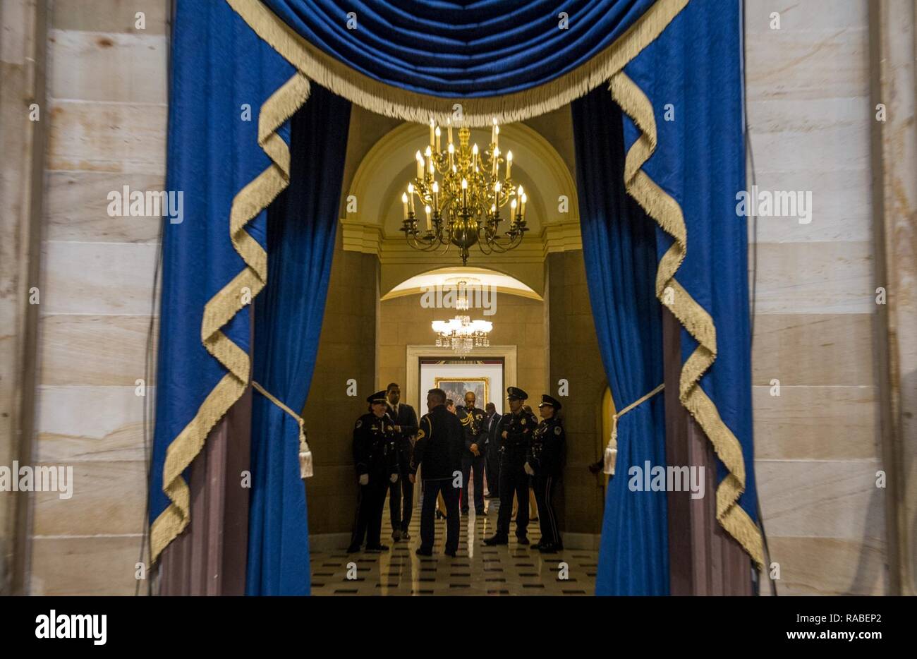 U.S. service members and capitol police wait for guests to arrive at