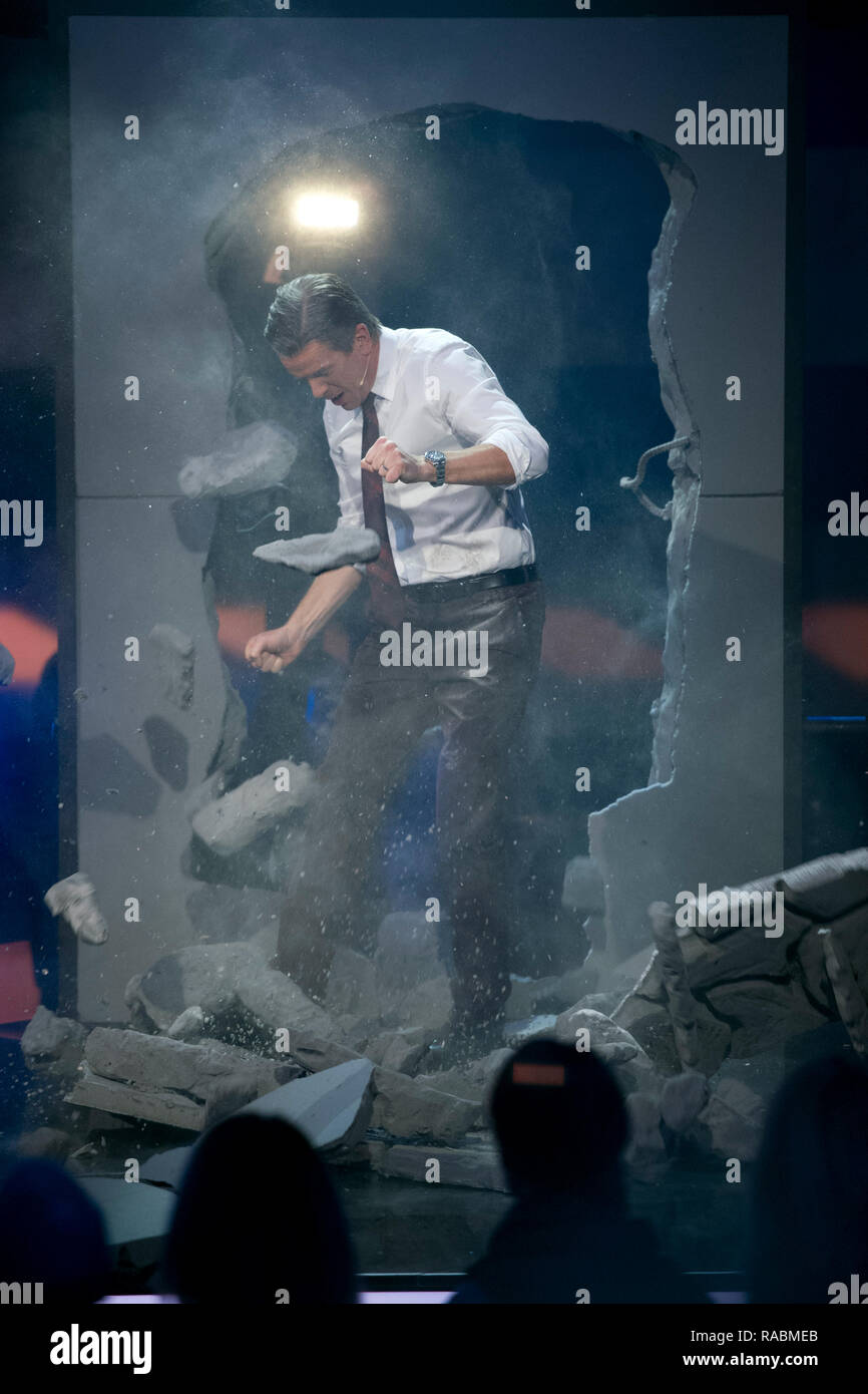 Moderator Markus LANZ, breaks through an artificial wall, produced by