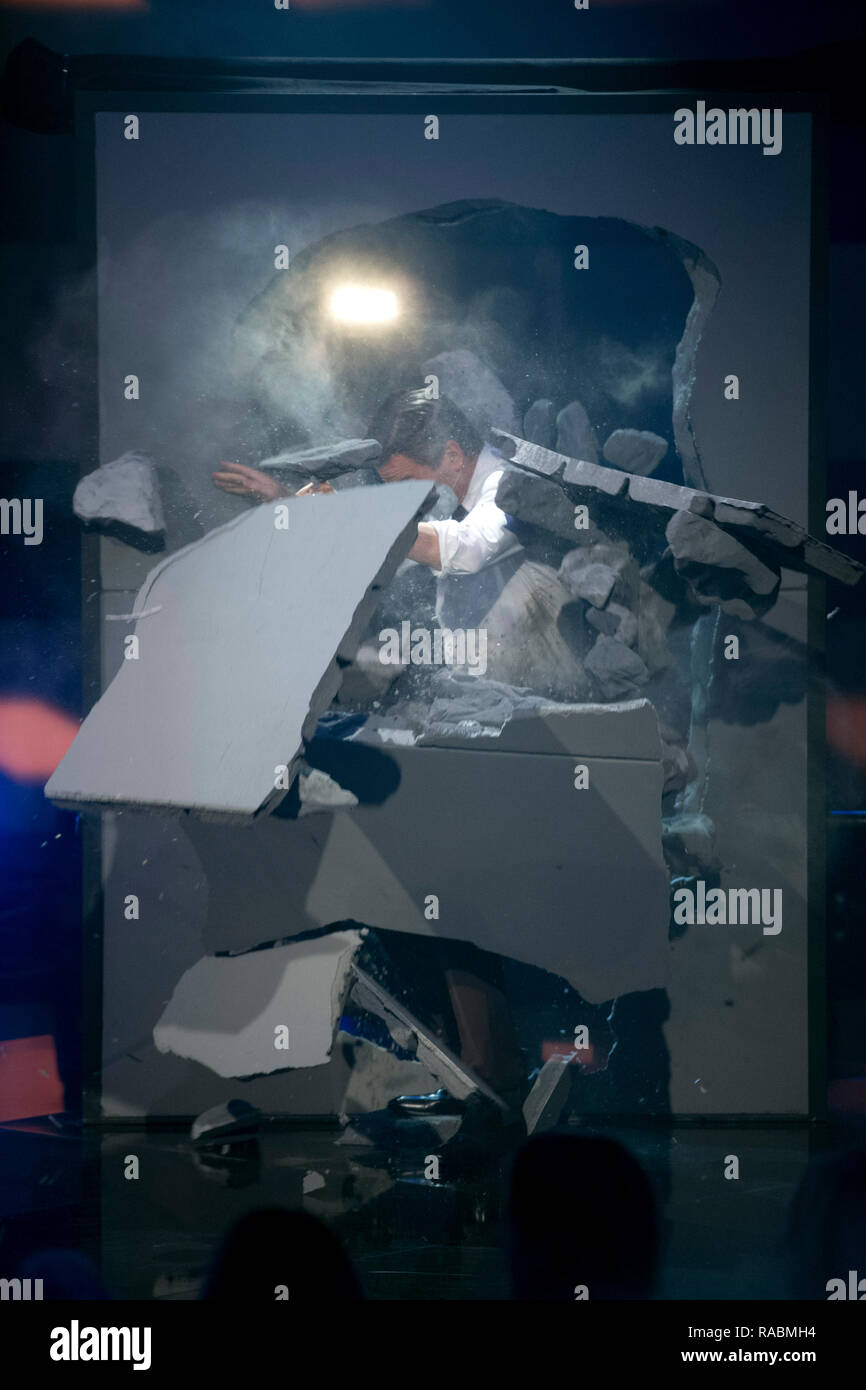 Moderator Markus LANZ, breaks through an artificial wall, produced by