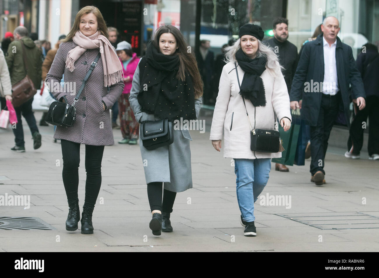 A woman dresses in warm clothes against the cold on Oxford Street