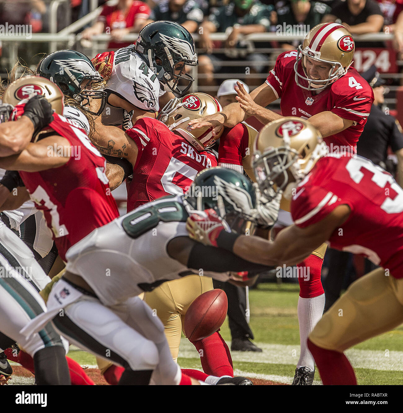 Santa Clara, California, USA. 28th Sep, 2014. San Francisco 49ers punter Andy Lee (4) get caught while his punt was blocked in the first quarter on Sunday, September 28, 2014 in Santa Clara, California. The 49ers defeated the Eagles 26-21. Credit: Al Golub/ZUMA Wire/Alamy Live News Stock Photo