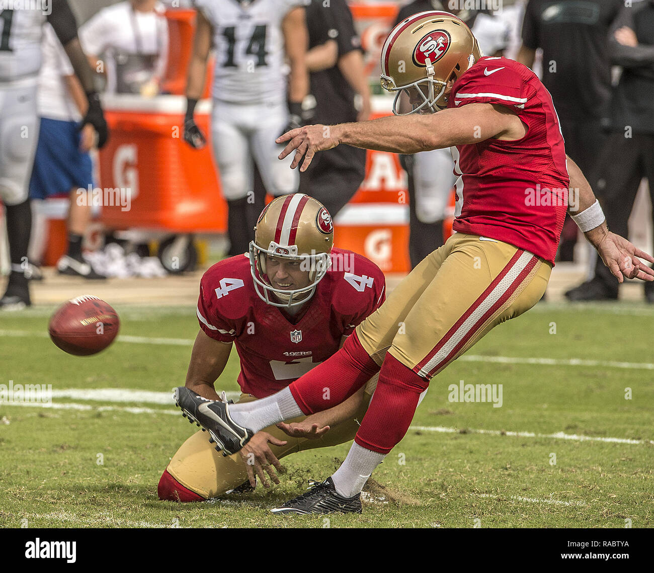 Santa Clara, California, USA. 28th Sep, 2014. San Francisco 49ers punter Andy Lee (4) holds while kicker Phil Dawson (9) kicks field goal on Sunday, September 28, 2014 in Santa Clara, California. The 49ers defeated the Eagles 26-21. Credit: Al Golub/ZUMA Wire/Alamy Live News Stock Photo