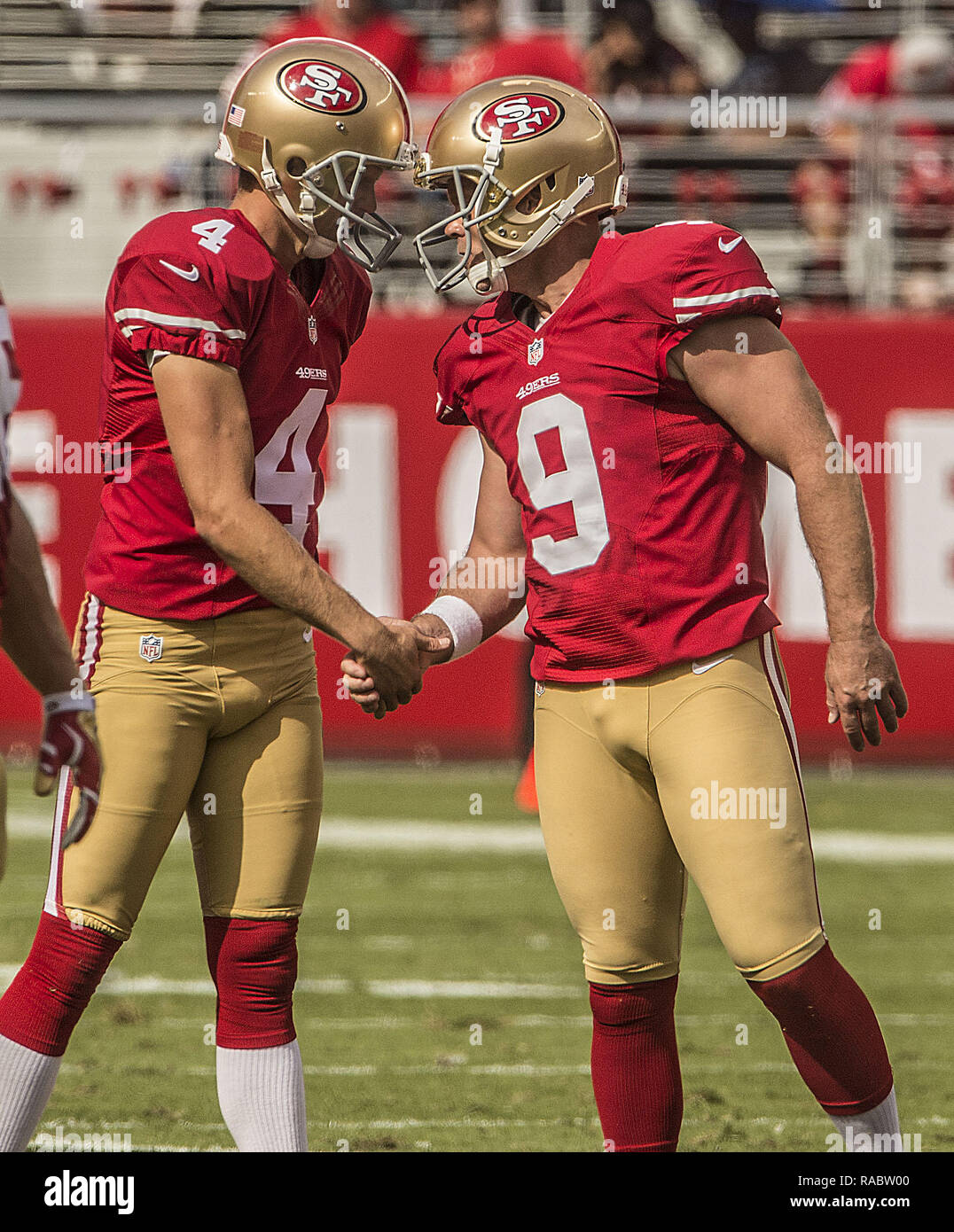 Santa Clara, California, USA. 28th Sep, 2014. San Francisco 49ers punter Andy Lee (4) congratulates kicker Phil Dawson (9) on field goal on Sunday, September 28, 2014 in Santa Clara, California. The 49ers defeated the Eagles 26-21. Credit: Al Golub/ZUMA Wire/Alamy Live News Stock Photo